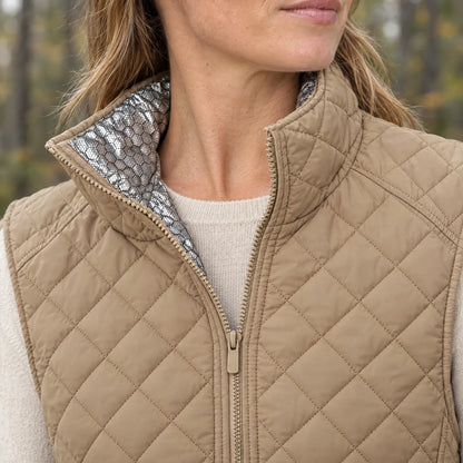 High collar of the beige vest with silver honeycomb lining